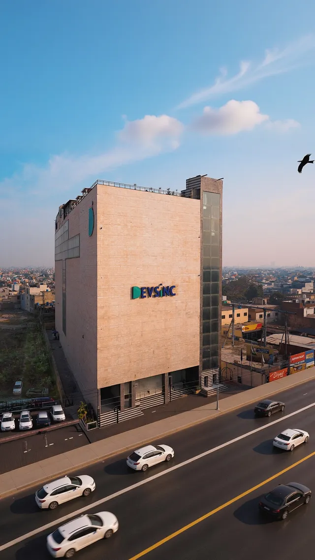 Devsinc office building beside a busy road