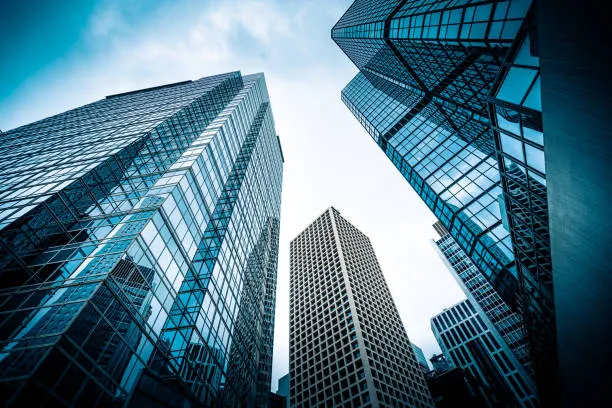 Low-angle view of glass office skyscrapers