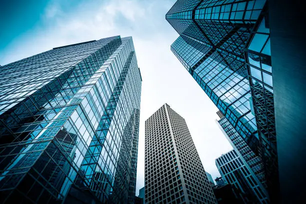Low-angle view of glass office skyscrapers