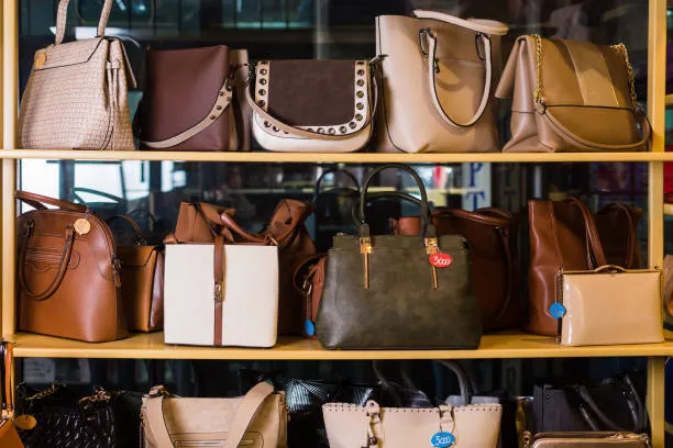Handbags displayed on a retail shelf